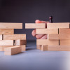 wooden blockes stacked bridge hand