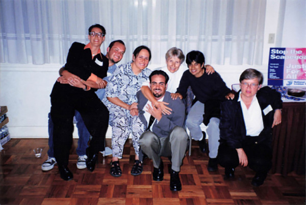 Valenzuela (center) with activists, 1994