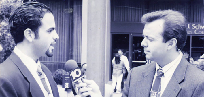 Valenzuela (left) speaking with a reporter, 1990s