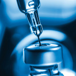 vaccine needle going into syringe