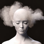 Brain fog. Close-up of a stressed female figure with fog around her head on a dark background.