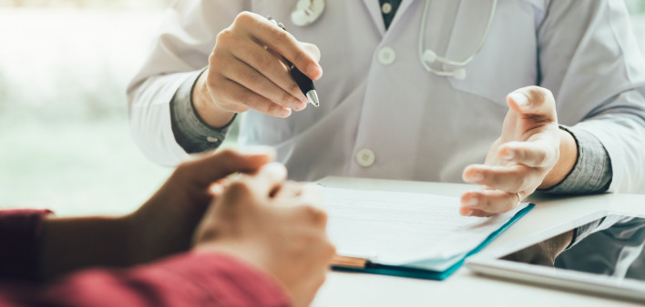 Doctor talking to the patient about menopause and treatment in future.