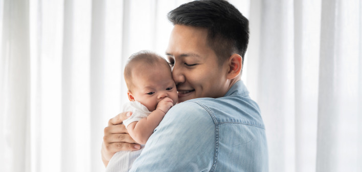 man and baby father holding baby