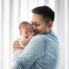 man and baby father holding baby