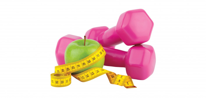 Diet, fitness and sport concept. Pink dumbbell, measuring tape and green apple on white background