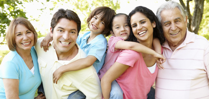 A multi-generational latin family having fun outdoors