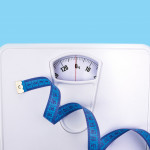 scale and blue tape measure weight
