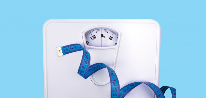 scale and blue tape measure weight