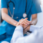hands of nurse and patient