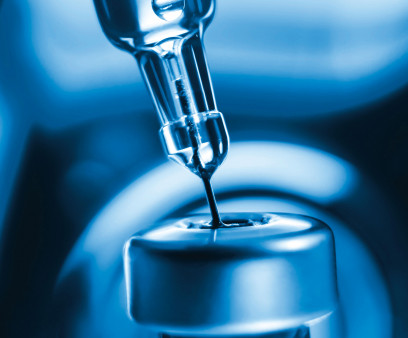 vaccine needle going into syringe