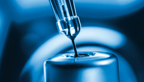 vaccine needle going into syringe