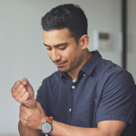 man holding wrist in pain