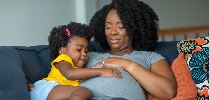 pregnant mother and young girl