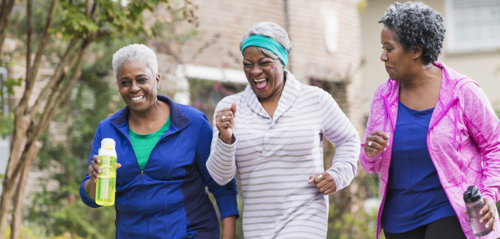 Three senior black women exercising together