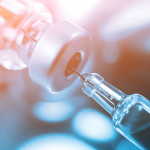 syringe in vial vaccine