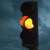 yellow caution light at dusk
