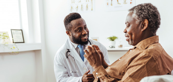 Black doctor and black patient consultation