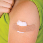 arm with band aid after vaccine
