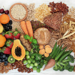 food with high fiber content for a healthy diet with fruit, vegetables, whole wheat bread, pasta, nuts, legumes, grains and cereals