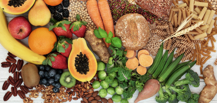 food with high fiber content for a healthy diet with fruit, vegetables, whole wheat bread, pasta, nuts, legumes, grains and cereals