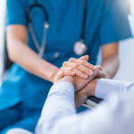 hands of nurse and patient
