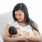 Asain mother breatfeeding baby