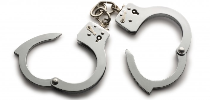 a pair of unlocked hand cuffs