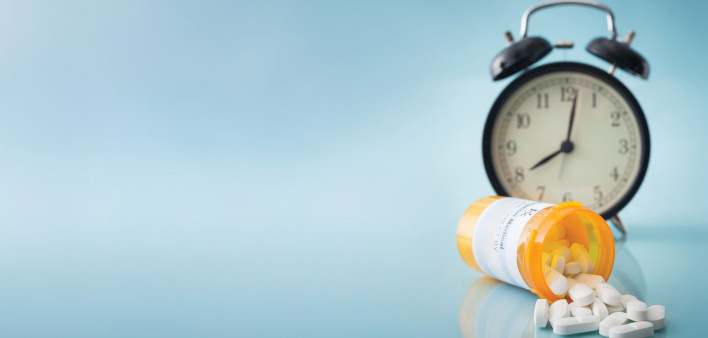 alarm clock and pills medication