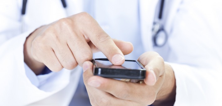  a doctor touching a smart phone