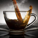 coffee pouring into a clear glass cup