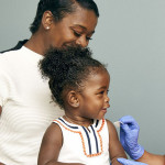 little girl and mother vaccine