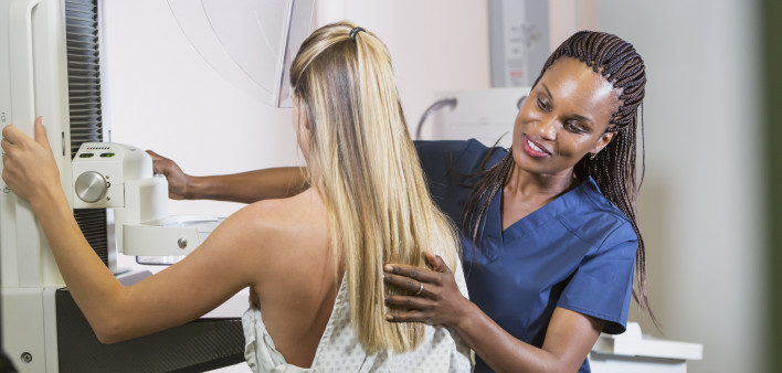 Woman getting mammogram