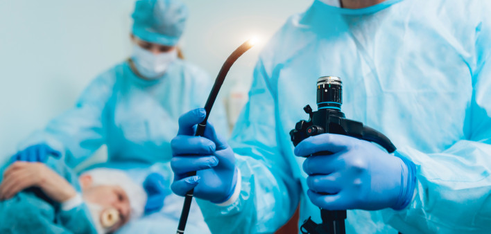 Endoscopy at the hospital. Doctor holding endoscope before gastroscopy stock photo Colonoscopy, Endoscope, Esophagus, Doctor, Patient