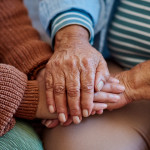 hands together three generations women