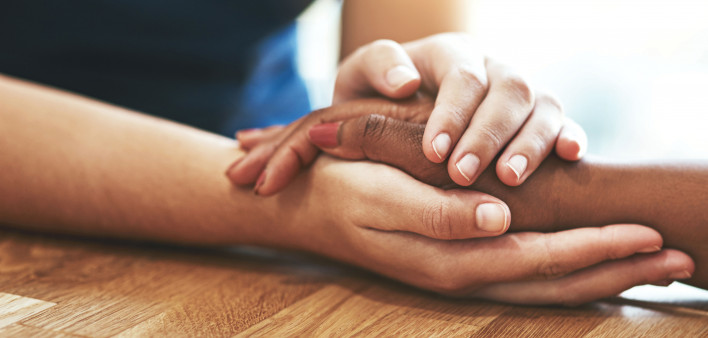 hands holding other hands compassion caring