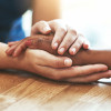 hands holding other hands compassion caring