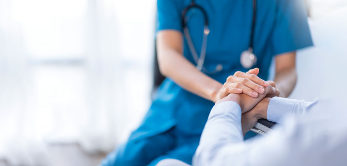 hands of nurse and patient
