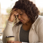 African American middle age woman looking sad.