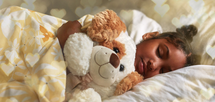 Shot of an adorable young girl sleeping peacefully in her bed