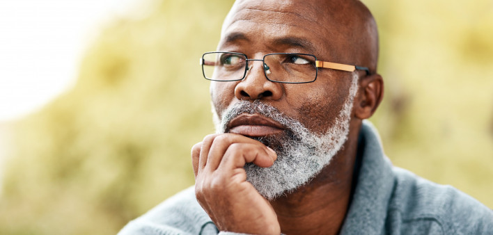 senior man outdoors thinking