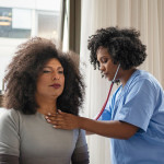 Black Doctor and Patient stethoscope