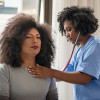 Black Doctor and Patient stethoscope