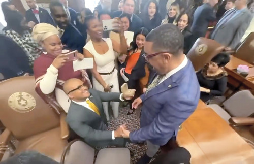 Venton Jones (kneeling) proposes to his