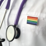 Woman doctor with lgbt flag on the pocket