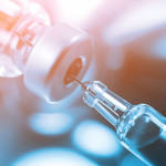 syringe in vial vaccine