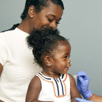 little girl and mother vaccine
