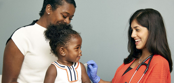little girl and mother vaccine