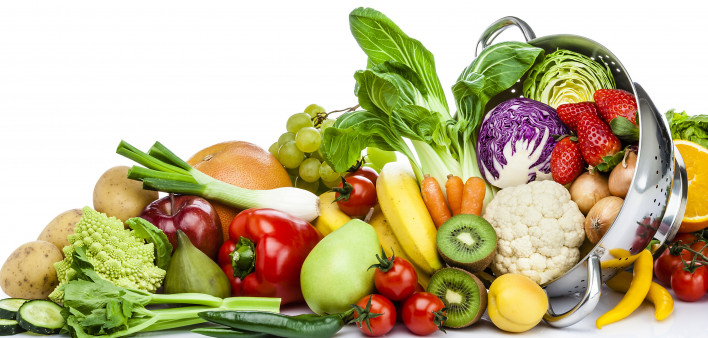 Healthy fresh fruits and vegetables in a colander