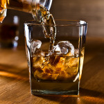 whiskey and natural ice on old wooden table