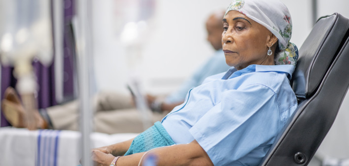Senior adult woman in the oncology unit receiving chemotherapy treatment.